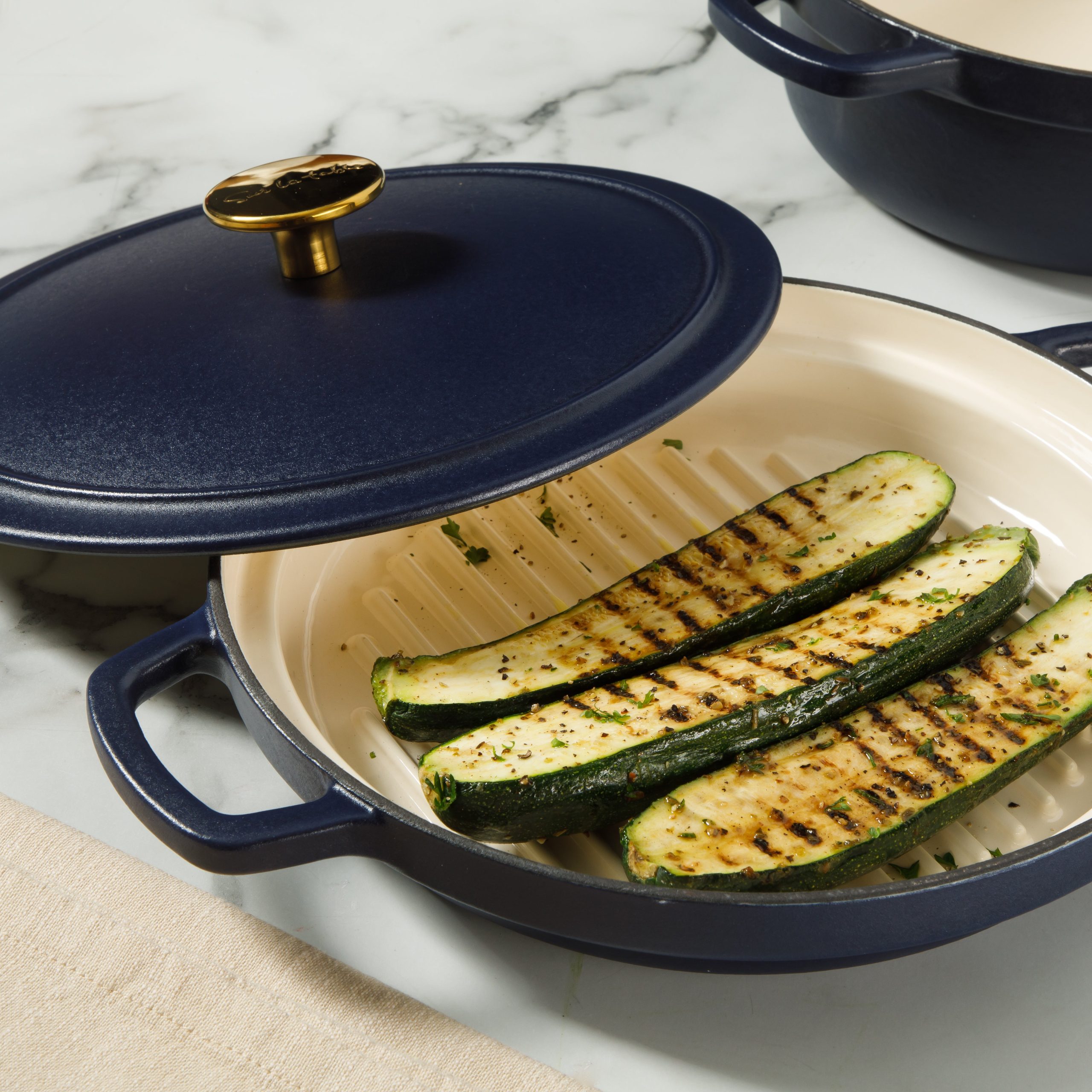 Sur La Table Kitchen Essentials 4-Piece Enameled Cast Iron Stackable Cookware Set, 5.3 Qt Dutch Oven with Lid, Braiser & Grill Pan, Navy Blue, Gold Knob Oven Safe to 500°F, Induction Compatible - Image 4